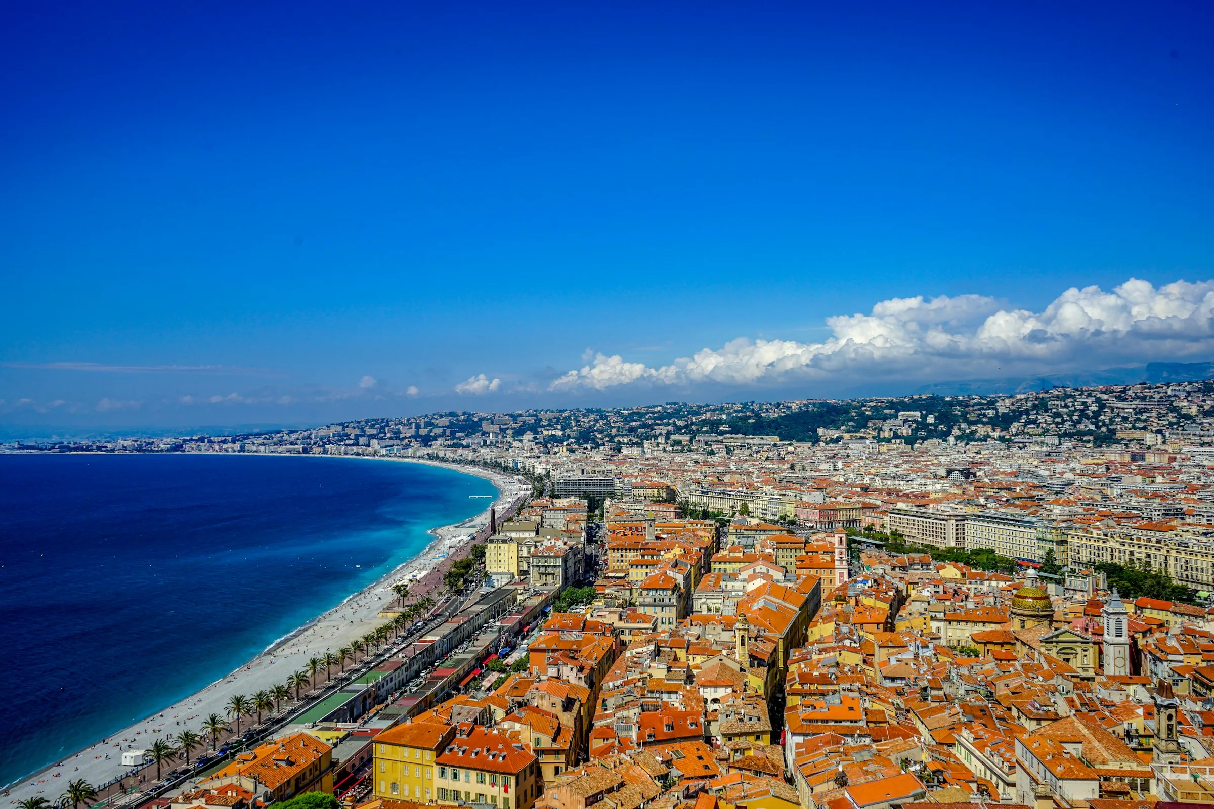 Aerial view of Nice, the sweep of the Baie des Anges and the terracotta roofs of the old town