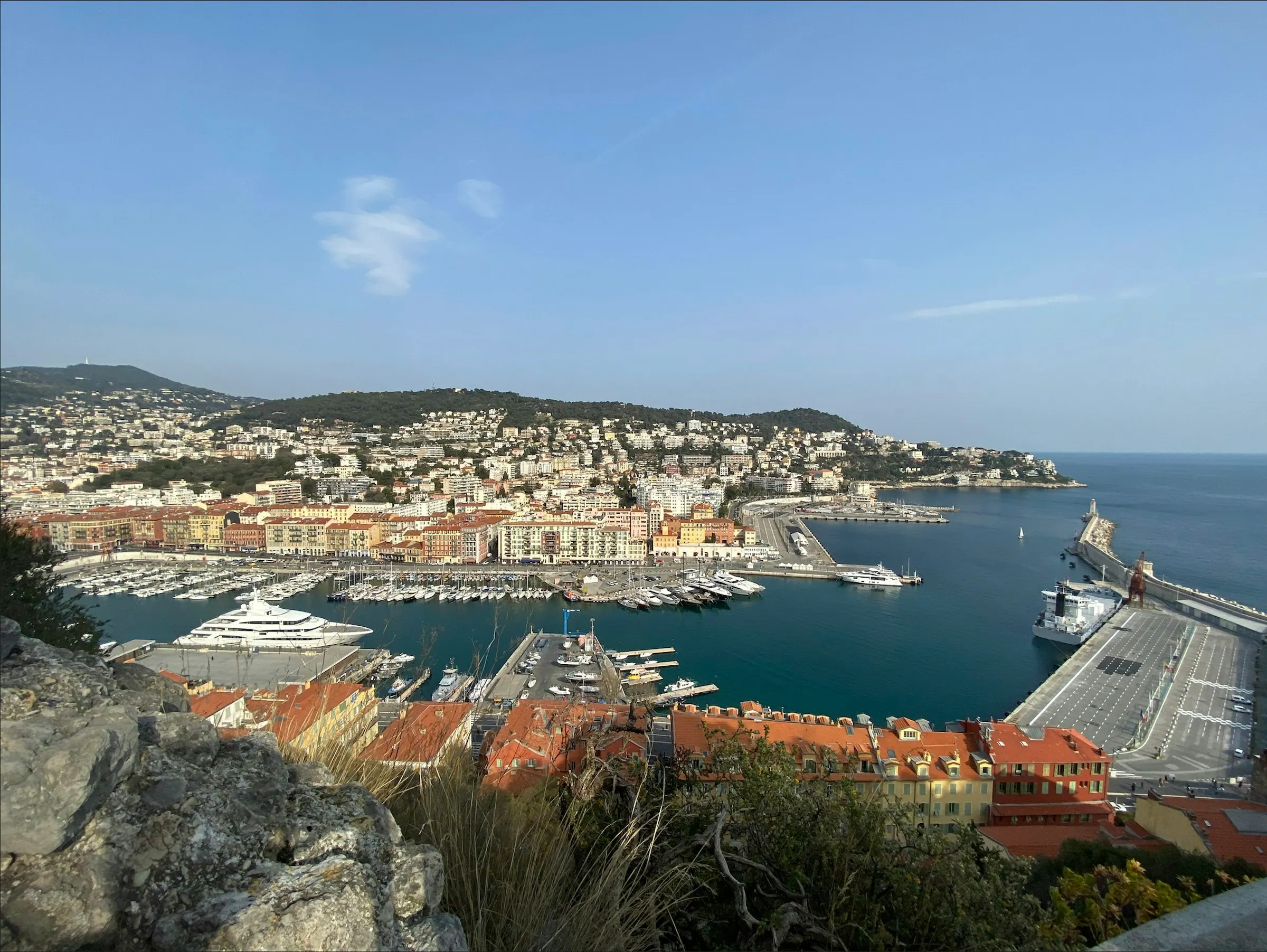 The Port Lympia harbour in Nice, yachts and pastel buildings around the marina